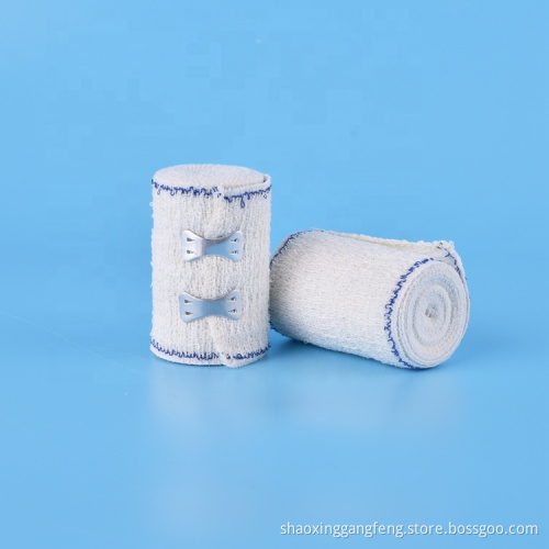 Absorbent elastic crepe bandage with blue/red line